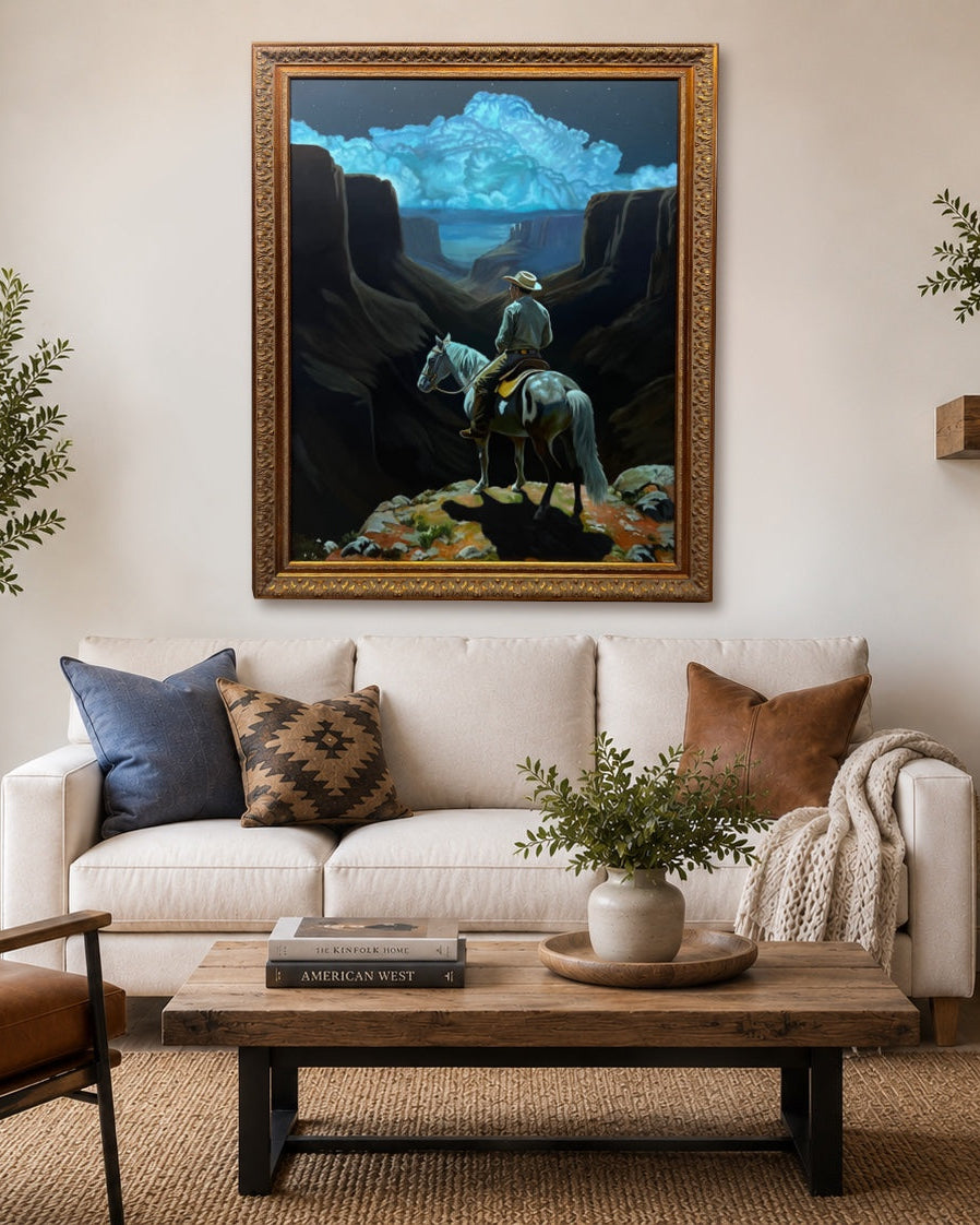 Living room with a white sofa, brown armchair, and a painting on the wall.